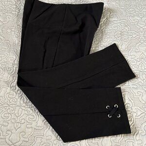 Black short stretch capris w/X eyelets on outer leg, size M